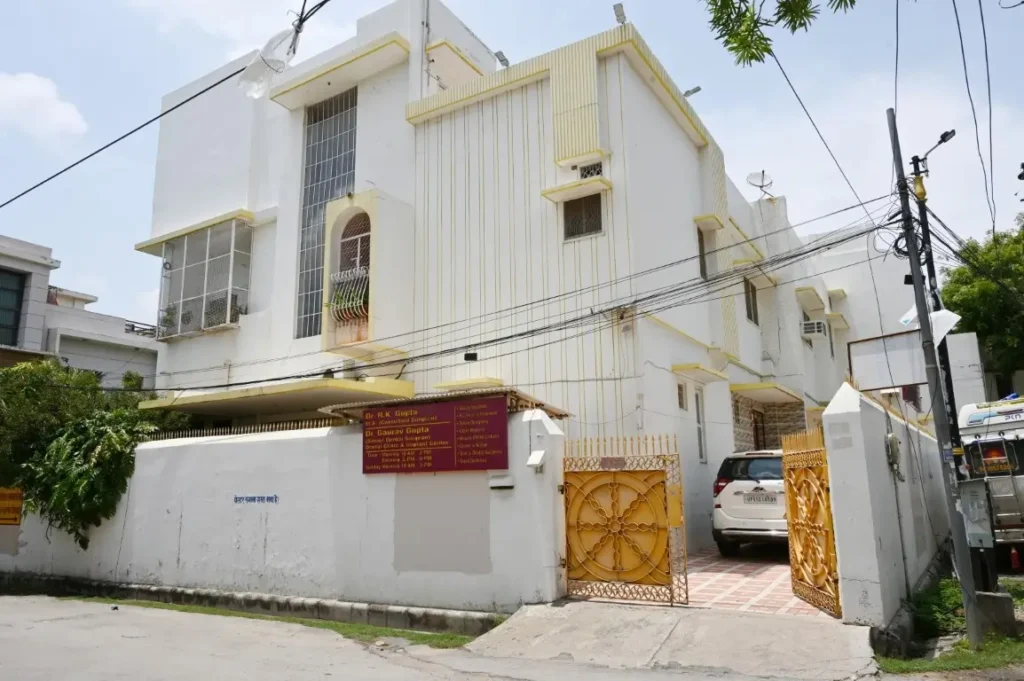 Exterior of Dr Gaurav Dental Clinic and Implant Center in Varanasi with free parking entrance gate