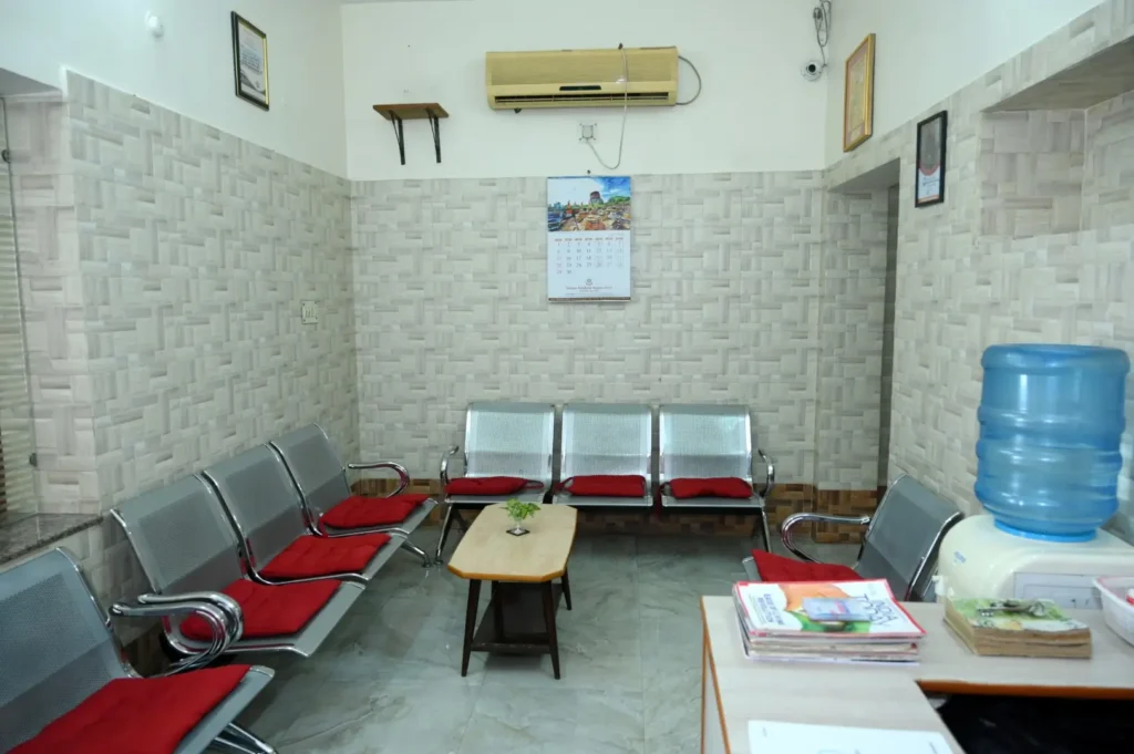 Air‑conditioned waiting area with seating, magzines and water coolers.